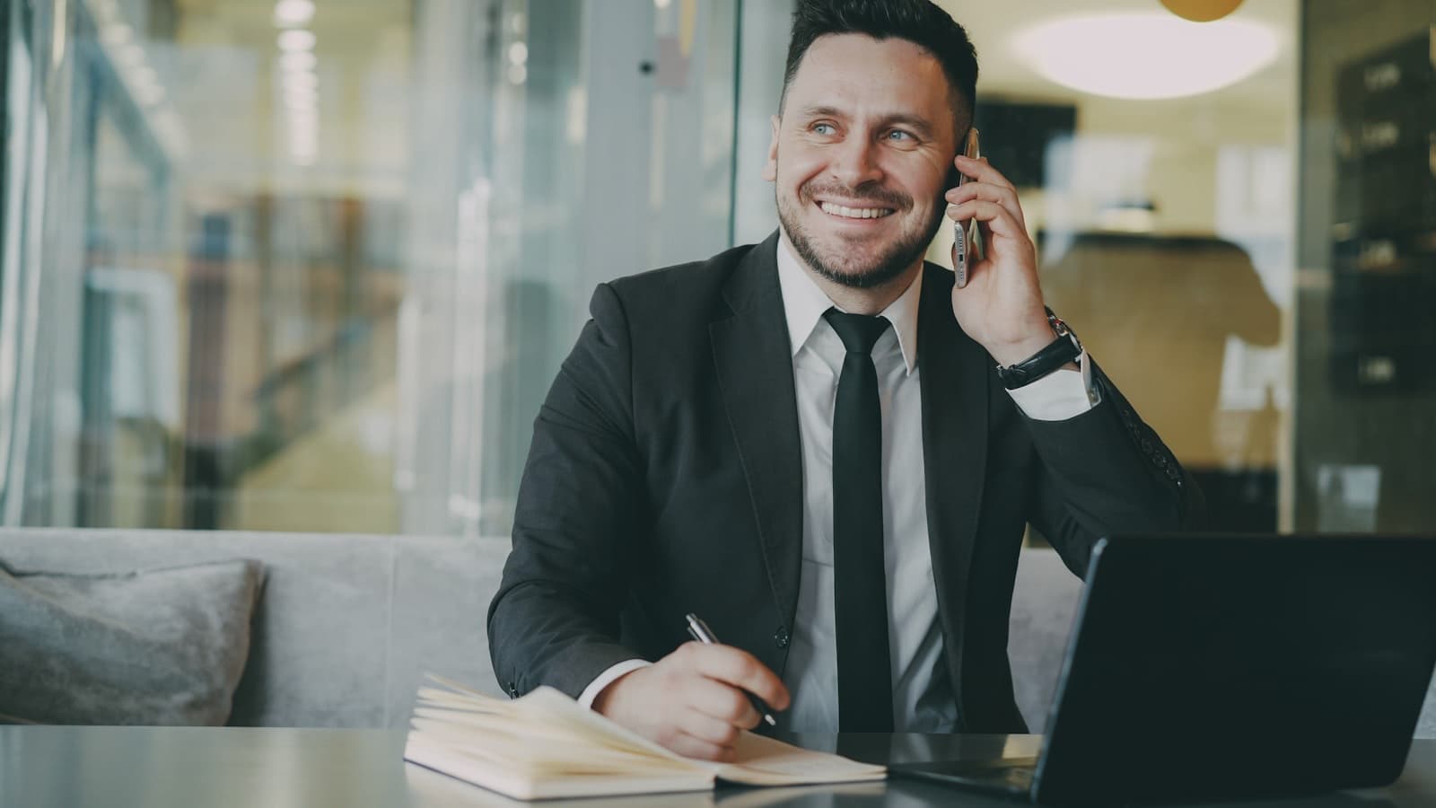 Personal assistant taking a call in a modern office